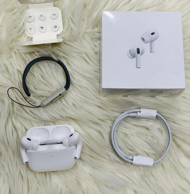 Noise-cancelling AirPods Pro 2nd Generation with charging case and accessories on fluffy background